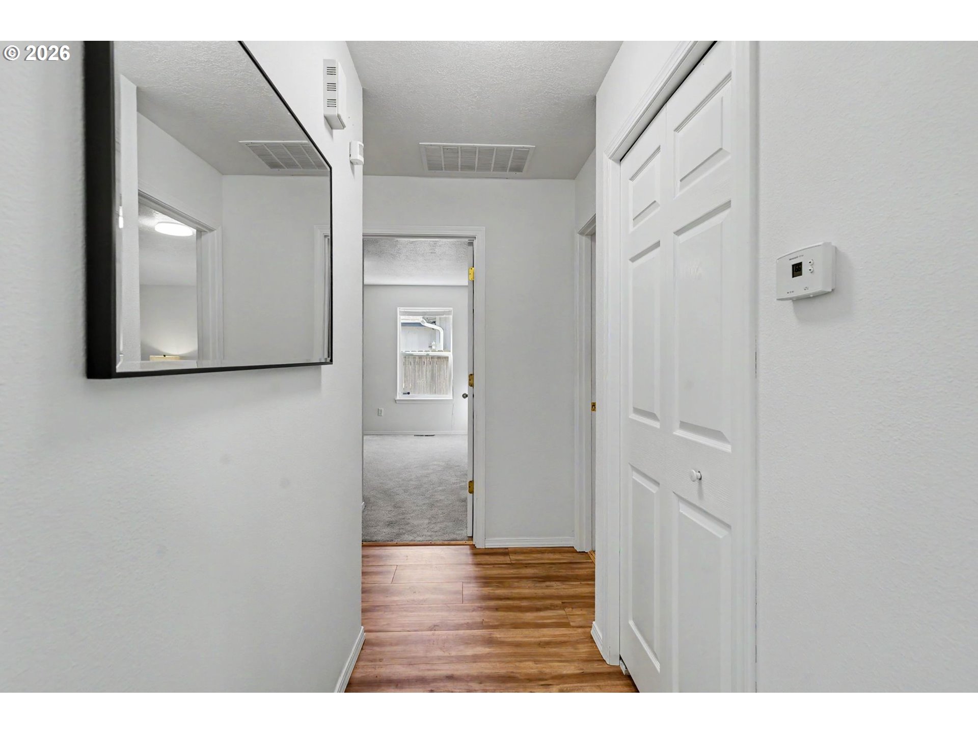 550 Southeast Hankel Street Dallas, OR 97338 - Photo 16 of 36 a view of a hallway with wooden floor and cabinet