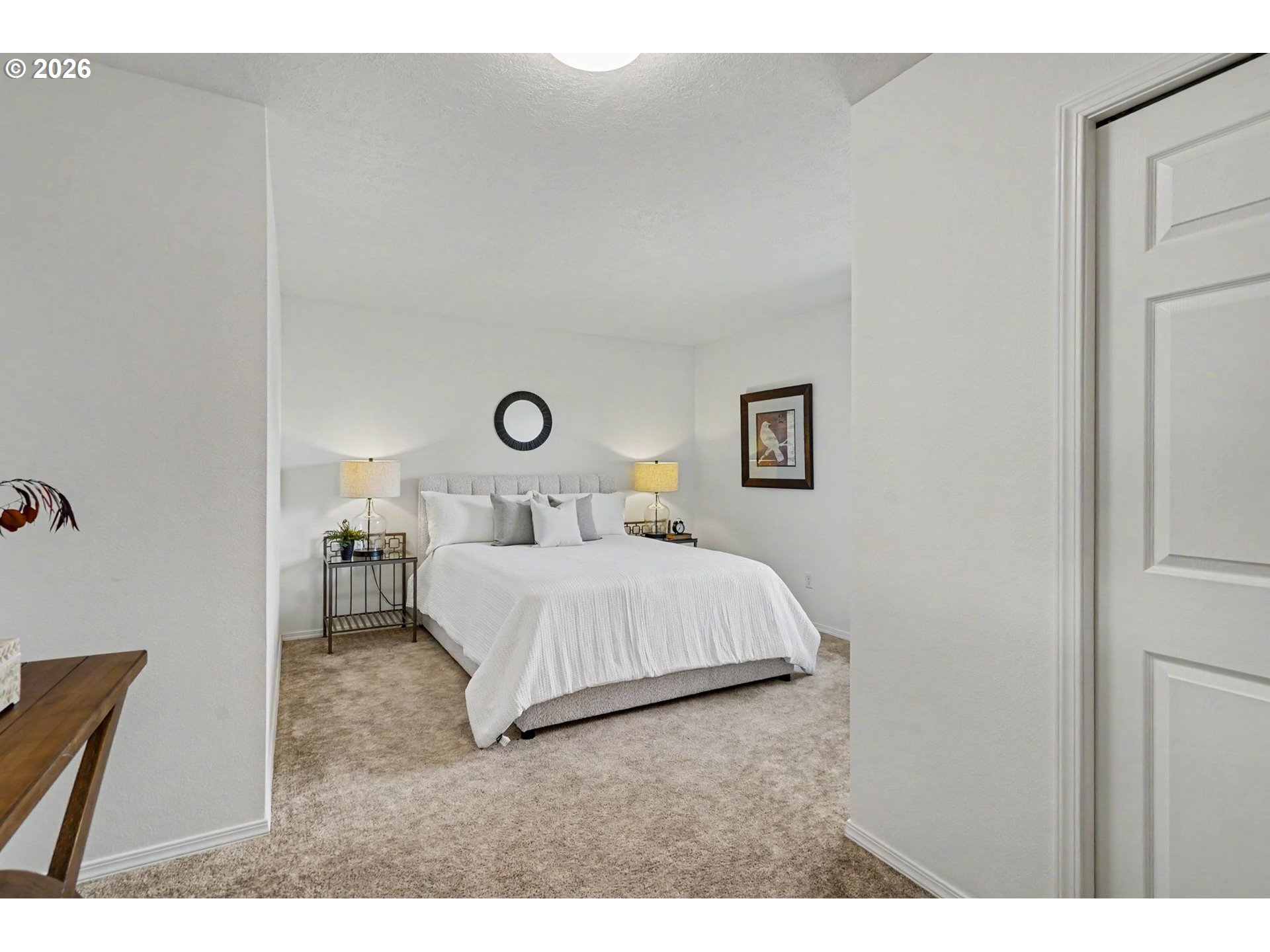 550 Southeast Hankel Street Dallas, OR 97338 - Photo 18 of 36 a bedroom with a bed and a night stand