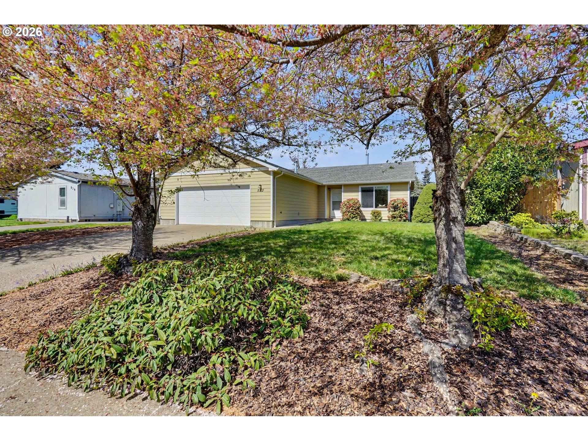 550 Southeast Hankel Street Dallas, OR 97338 - Photo 2 of 36 a house view with a garden space