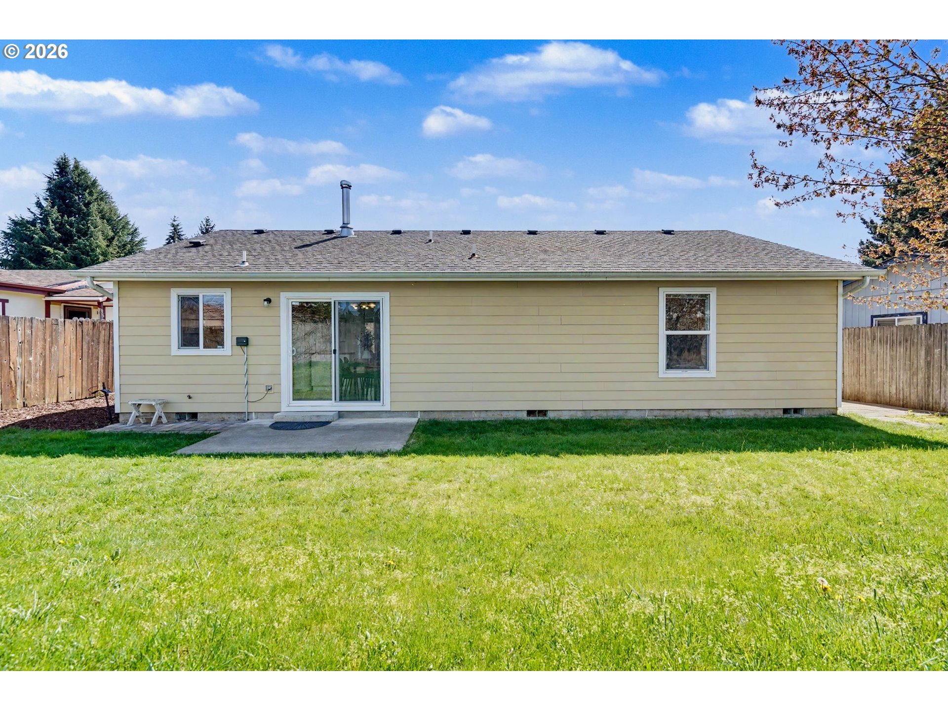 550 Southeast Hankel Street Dallas, OR 97338 - Photo 30 of 36 a view of a house with a backyard