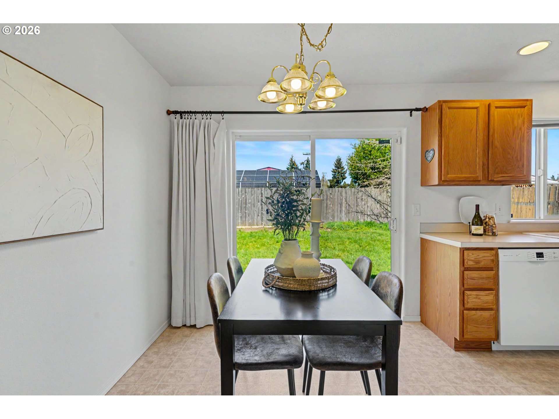 550 Southeast Hankel Street Dallas, OR 97338 - Photo 10 of 36 a view of a dining room with furniture a chandelier and wooden floor