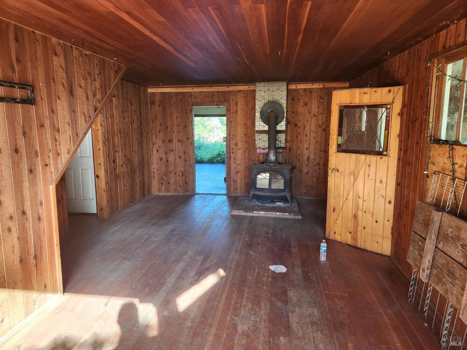 13333 Low Gap Road Ukiah, CA 95482 - Photo 4 of 50 a view of an empty room with wooden floor and a window
