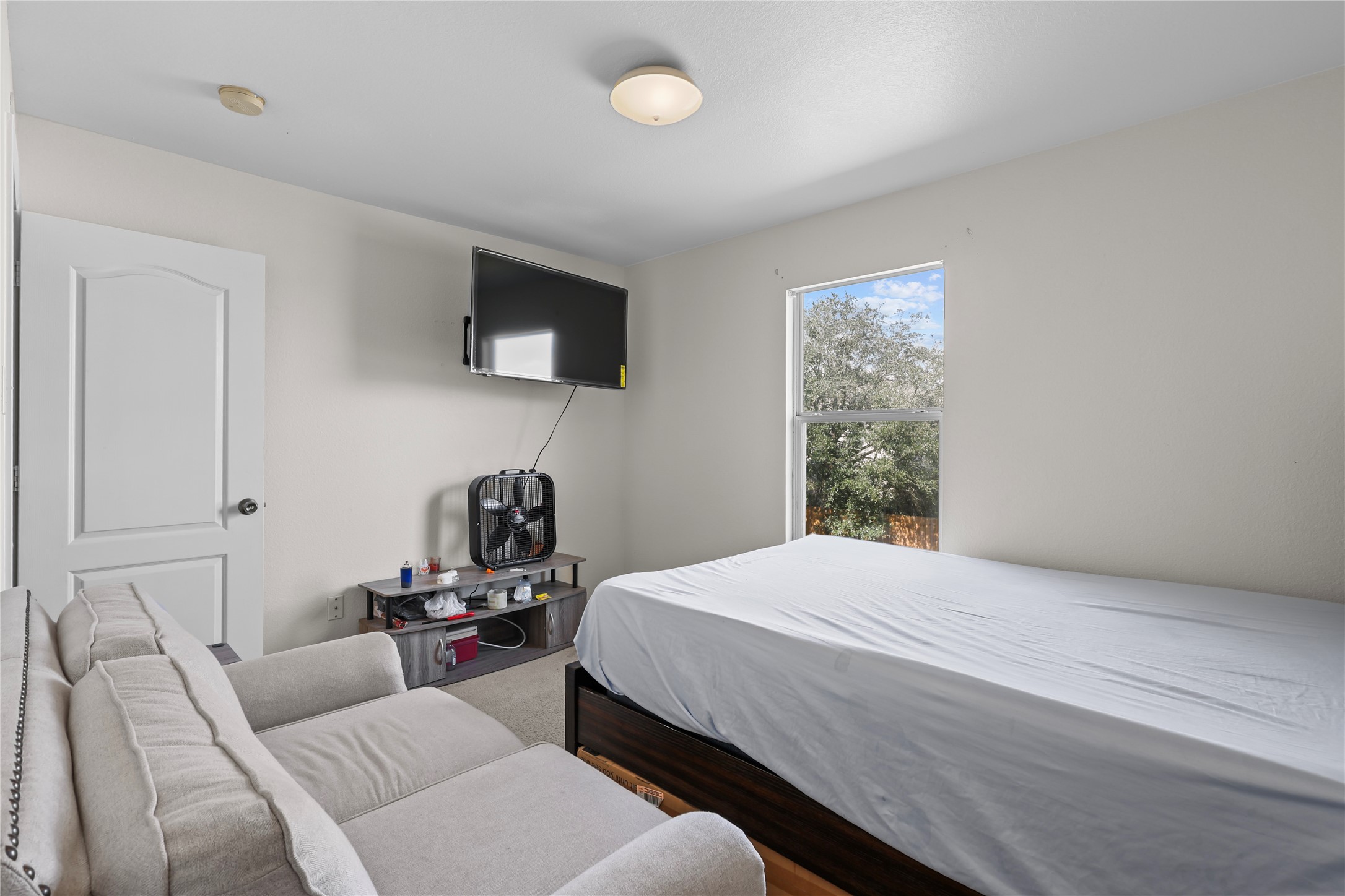 20806 Baronsledge Lane Katy, TX 77449 - Photo 11 of 23 a bedroom with a bed and a television