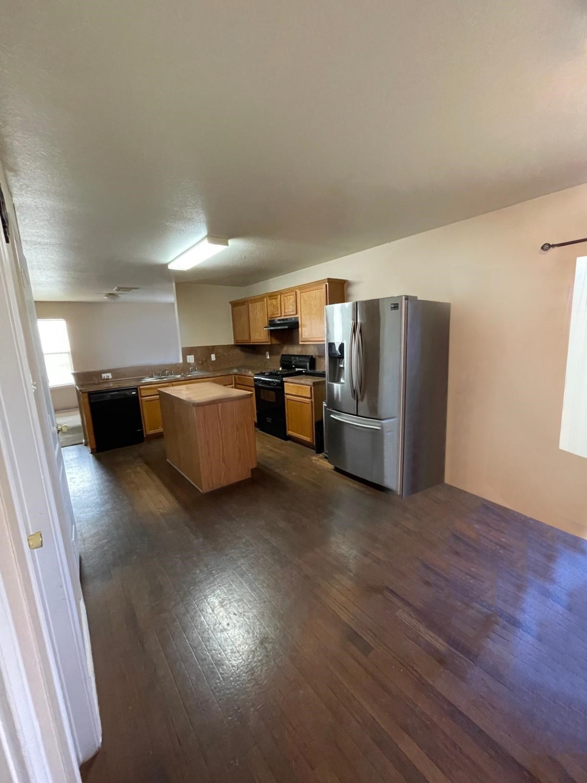 20806 Baronsledge Lane Katy, TX 77449 - Photo 8 of 23 a kitchen with stainless steel appliances wooden floors and large window
