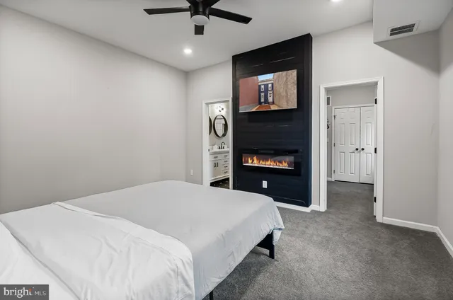 a bedroom with a bed and a television