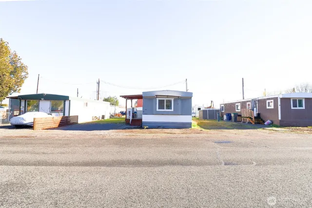 a view of a building with a street