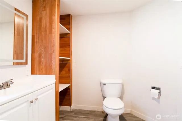 a bathroom with a toilet and a sink