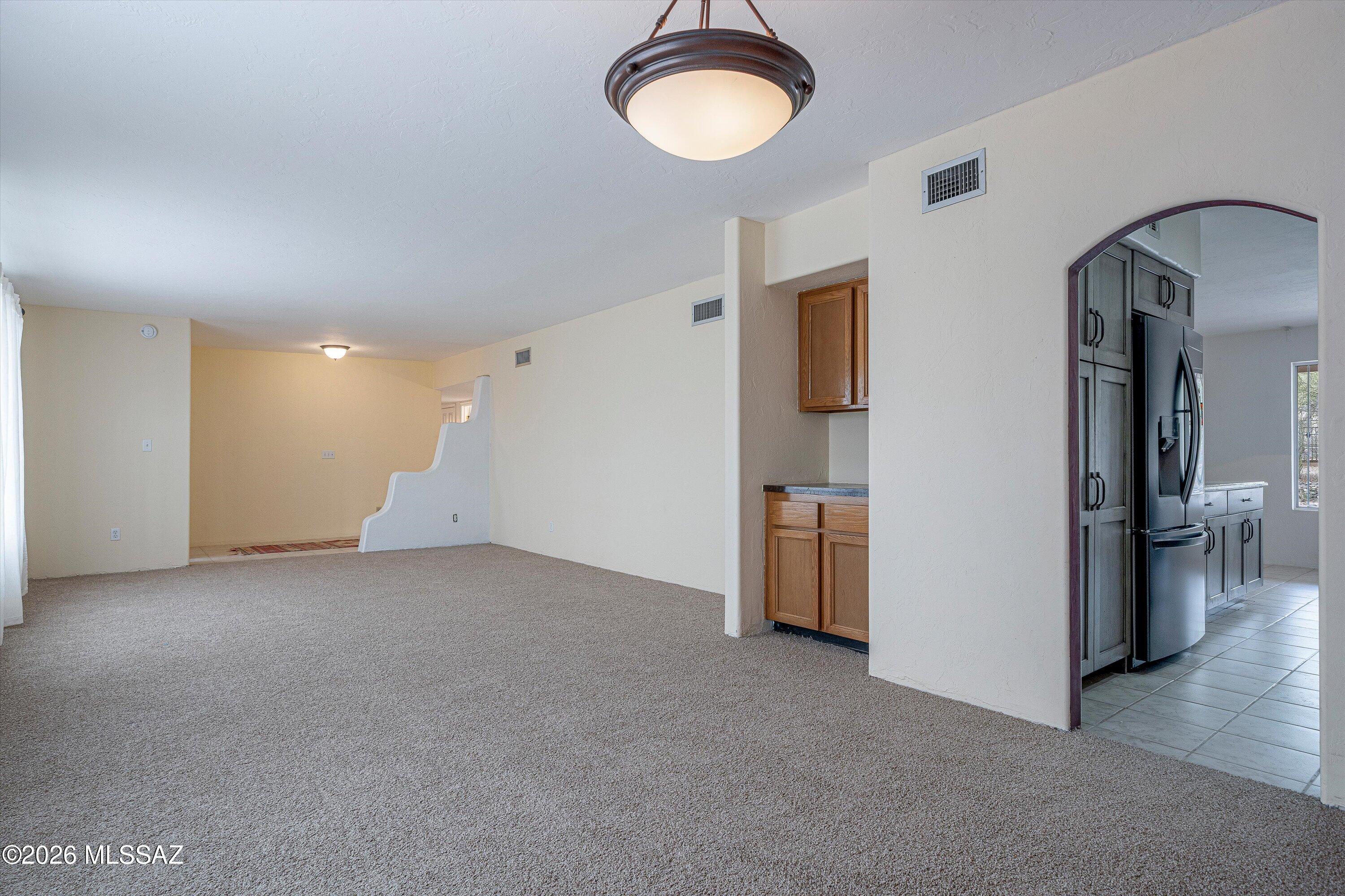 10961 East Roger Road Tucson, AZ 85749 - Photo 29 of 45 Arched entry to kitchen
