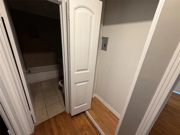 a view of front door with wooden floor