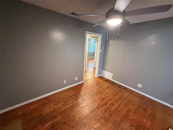 an empty room with fan