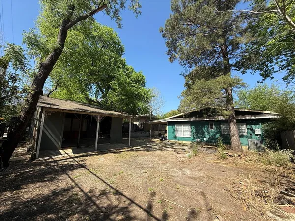a house with trees in the background