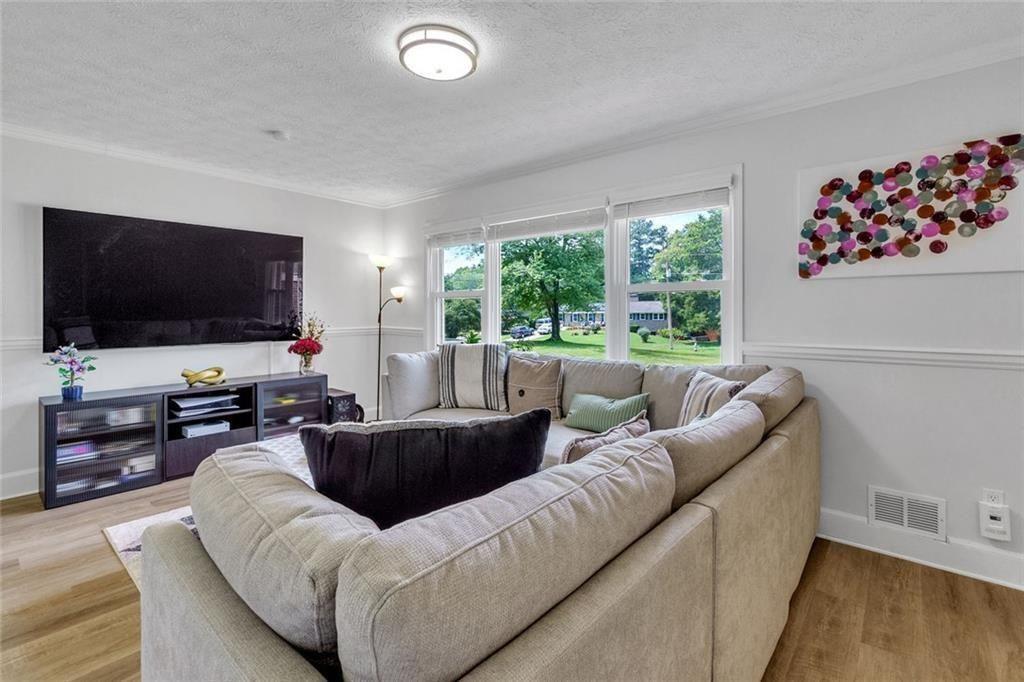 5800 Cedar Lane Southwest Mableton, GA 30126 - Photo 13 of 41 a living room with furniture and a flat screen tv