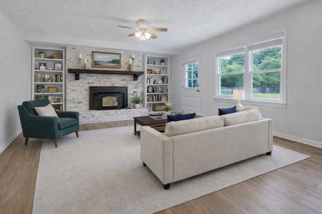 5800 Cedar Lane Southwest Mableton, GA 30126 - Photo 16 of 41 a living room with furniture and a fireplace