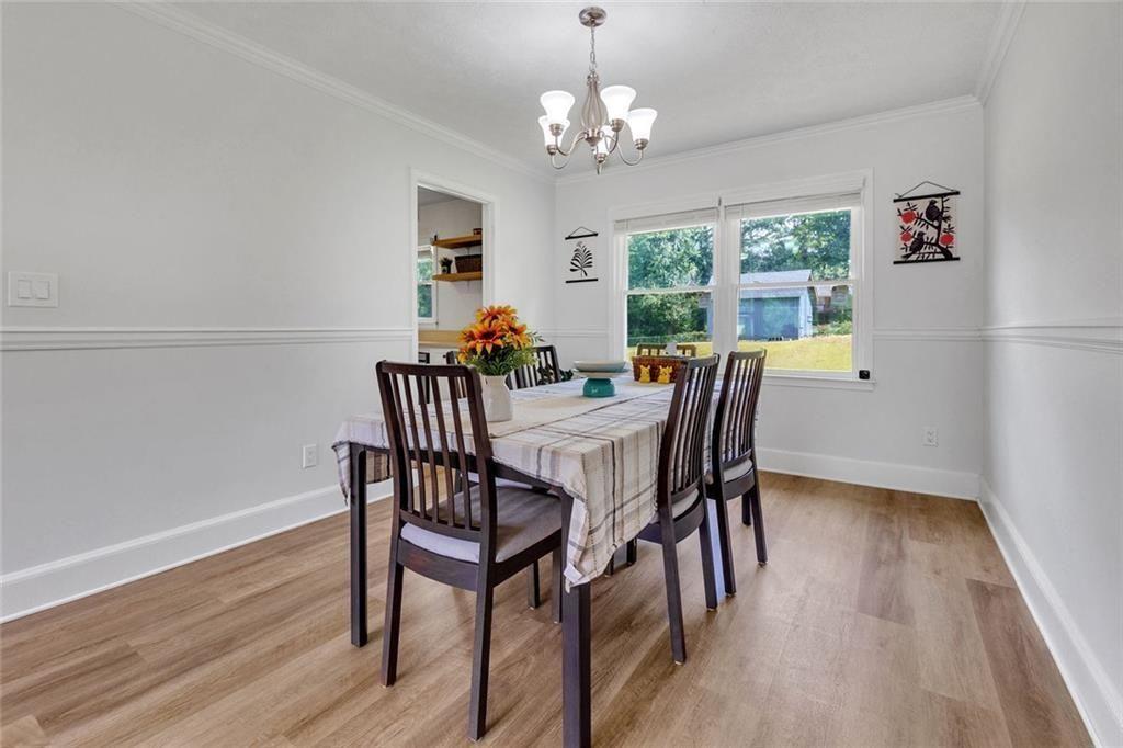 5800 Cedar Lane Southwest Mableton, GA 30126 - Photo 19 of 41 a view of a dining room with furniture window and wooden floor