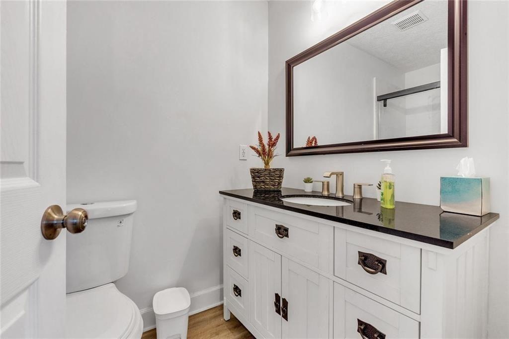 5800 Cedar Lane Southwest Mableton, GA 30126 - Photo 30 of 41 a bathroom with a sink vanity and a toilet