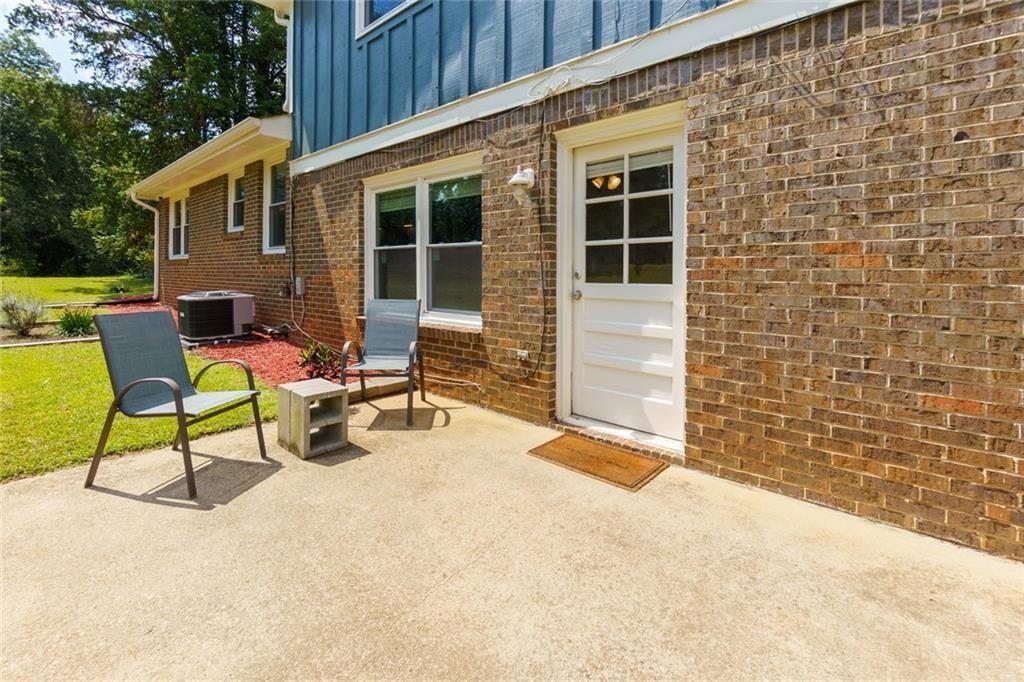 5800 Cedar Lane Southwest Mableton, GA 30126 - Photo 33 of 41 a backyard of a house with seating space