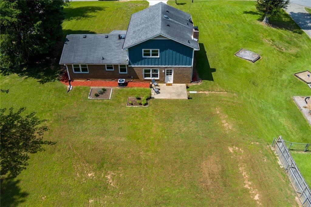 5800 Cedar Lane Southwest Mableton, GA 30126 - Photo 36 of 41 a front view of a house with a yard