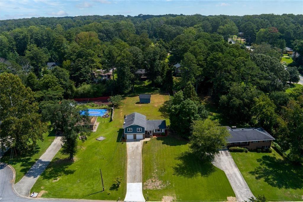 5800 Cedar Lane Southwest Mableton, GA 30126 - Photo 4 of 41 an aerial view of residential houses with outdoor space and trees all around