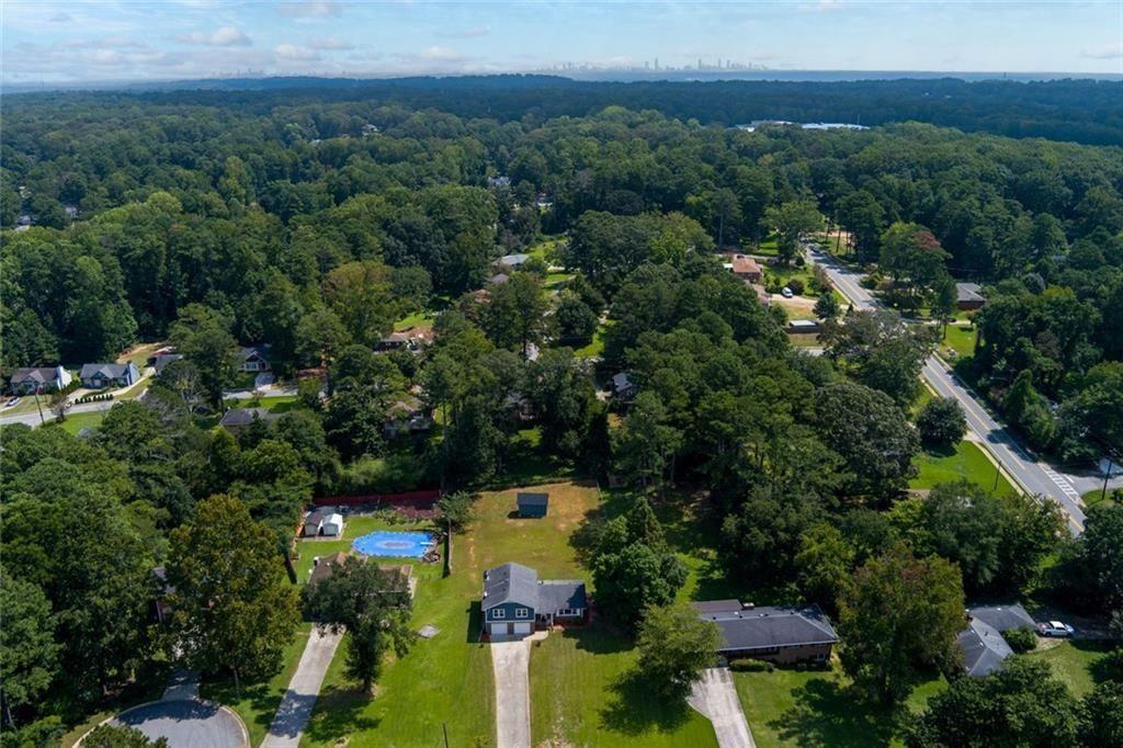 5800 Cedar Lane Southwest Mableton, GA 30126 - Photo 6 of 41 an aerial view of residential house with outdoor space and trees all around