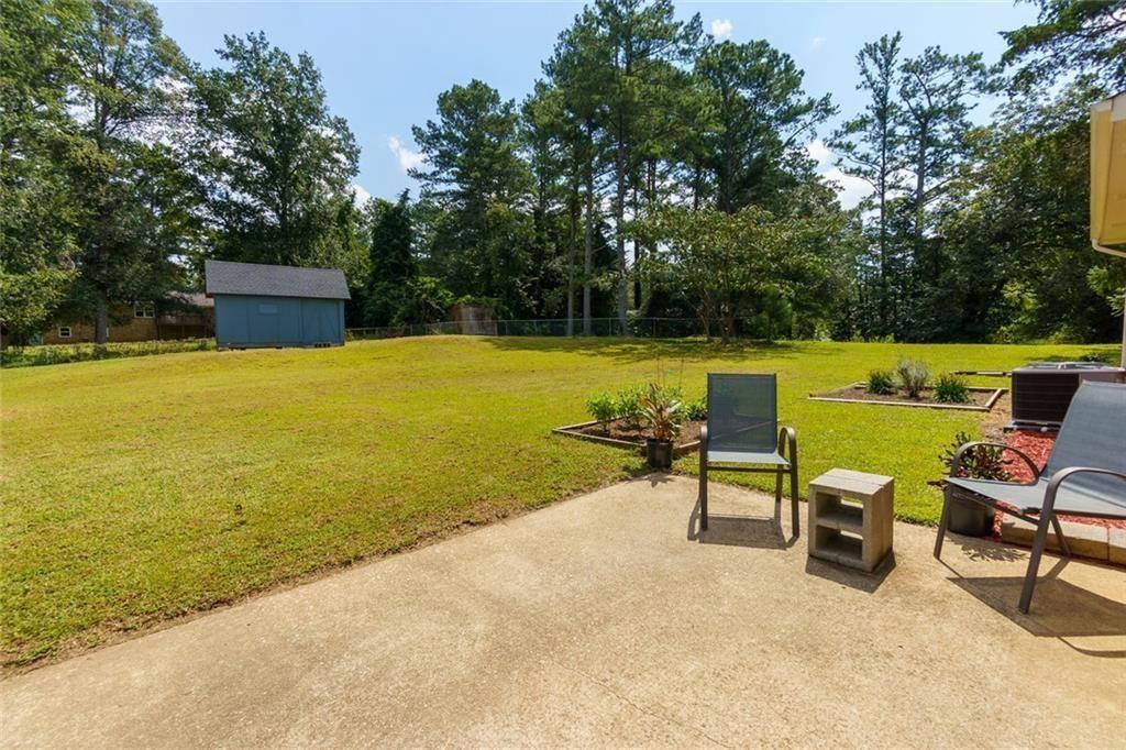 5800 Cedar Lane Southwest Mableton, GA 30126 - Photo 8 of 41 a view of a swimming pool with lounge chairs