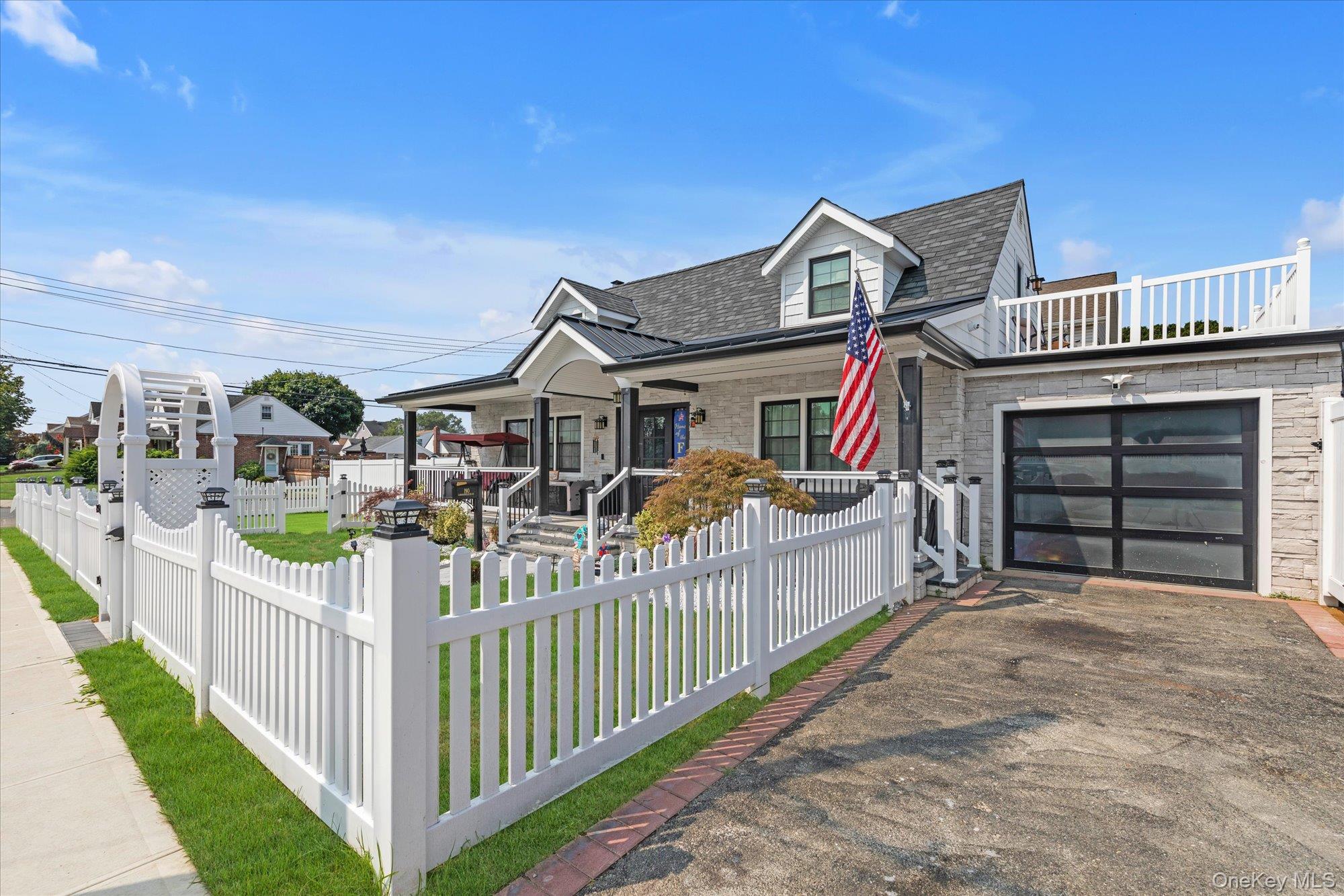 190 Commonwealth Street Franklin Square, NY 11010 - Photo 12 of 16 a view of a house with wooden fence