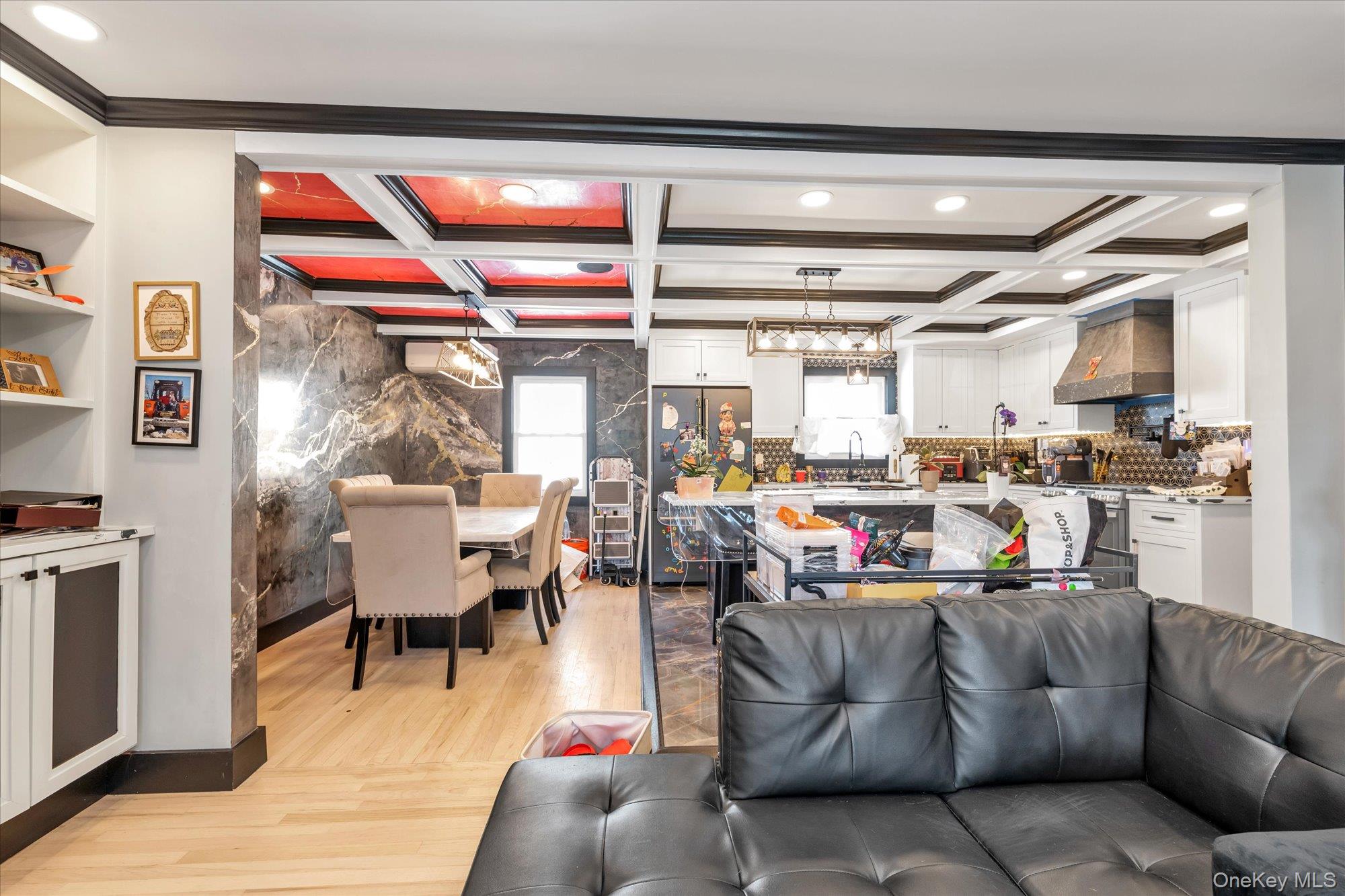190 Commonwealth Street Franklin Square, NY 11010 - Photo 2 of 16 a living room with lots of furniture and kitchen view