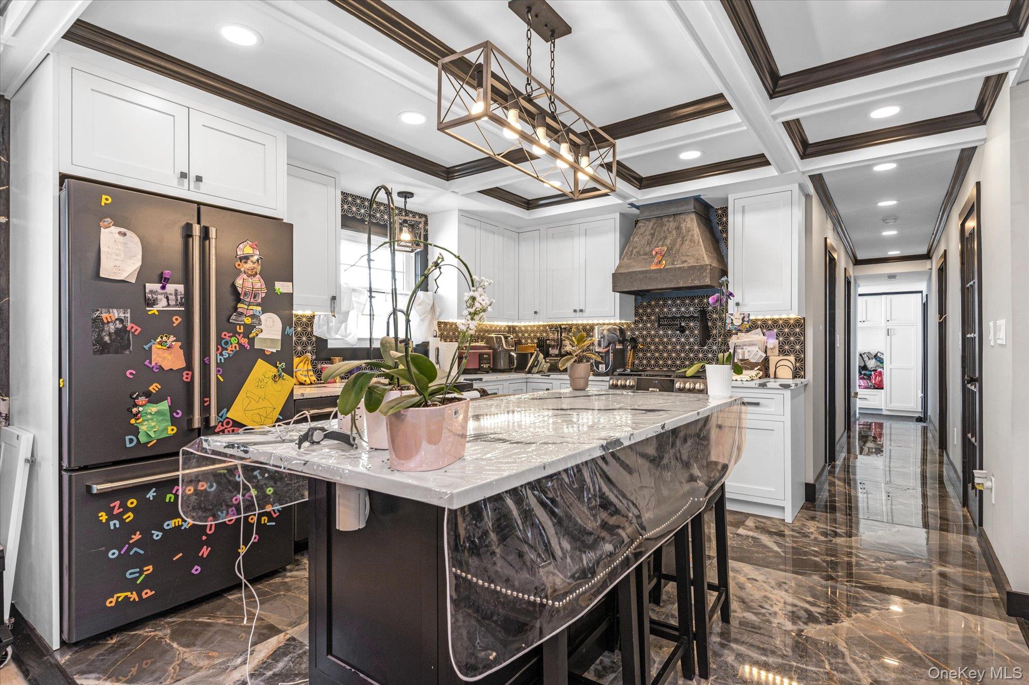 190 Commonwealth Street Franklin Square, NY 11010 - Photo 5 of 16 a room with stainless steel appliances kitchen island granite countertop lots of wooden furniture