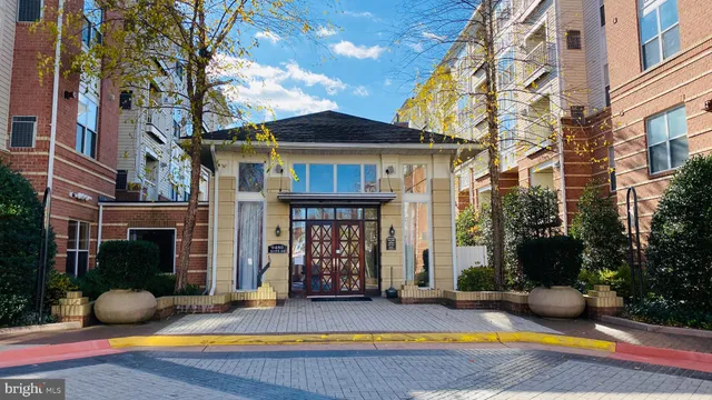 a view of a house with swimming pool and sitting area