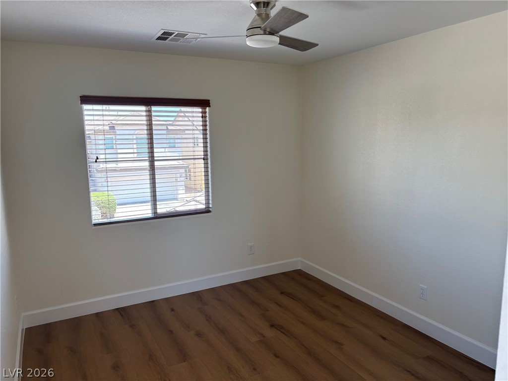 4900 Naff Ridge Drive Las Vegas, NV 89131 - Photo 17 of 21 Hardwood-style flooring and a ceiling fan enhance this compact, bright room.