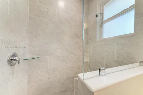 a bathroom with a sink and a shower