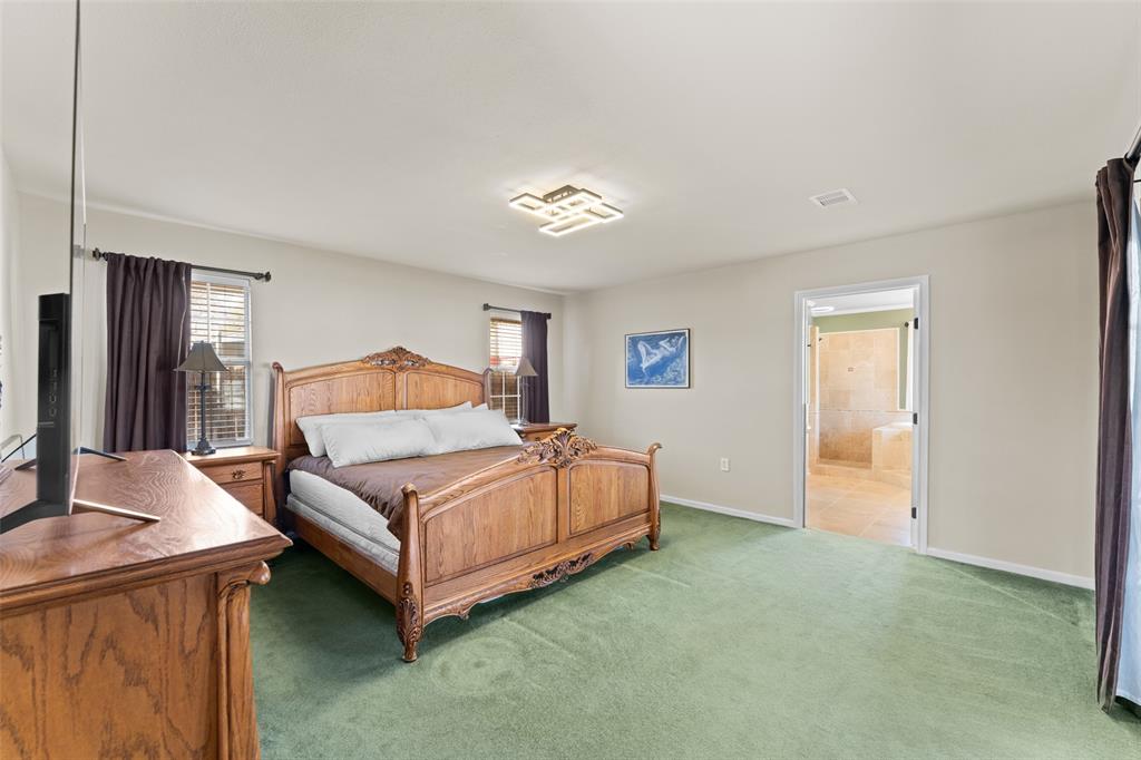 805 East Shady Grove Road Irving, TX 75060 - Photo 12 of 36 Carpeted bedroom with baseboards