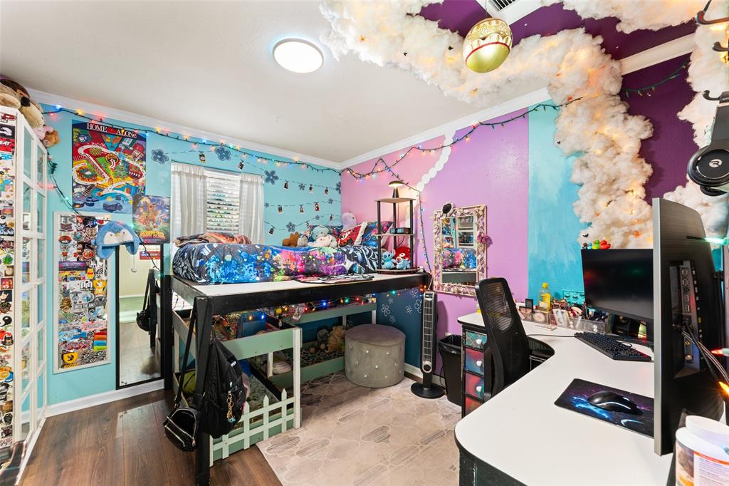 805 East Shady Grove Road Irving, TX 75060 - Photo 20 of 36 Bedroom with light wood-type flooring, an office area, and crown molding