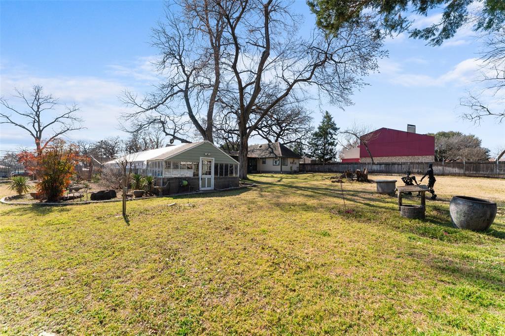 805 East Shady Grove Road Irving, TX 75060 - Photo 27 of 36 View of yard with a green house
