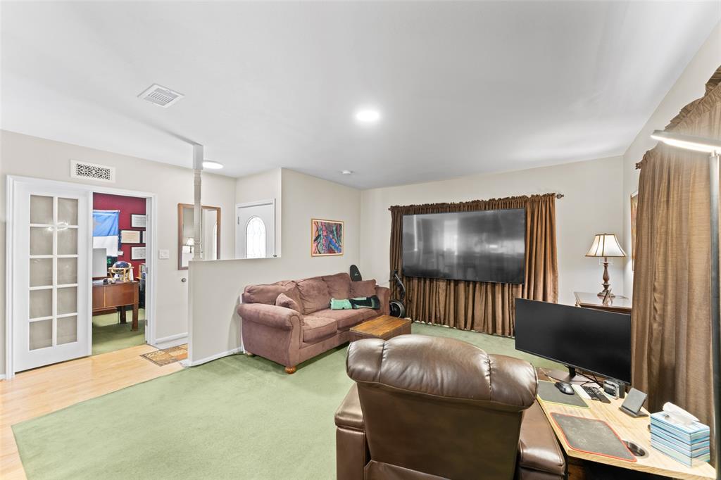 805 East Shady Grove Road Irving, TX 75060 - Photo 6 of 36 Living room featuring a desk and recessed lighting