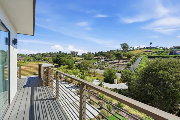 an aerial view of a house with a ocean view