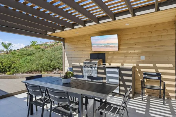 a view of a house with a yard porch and sitting area