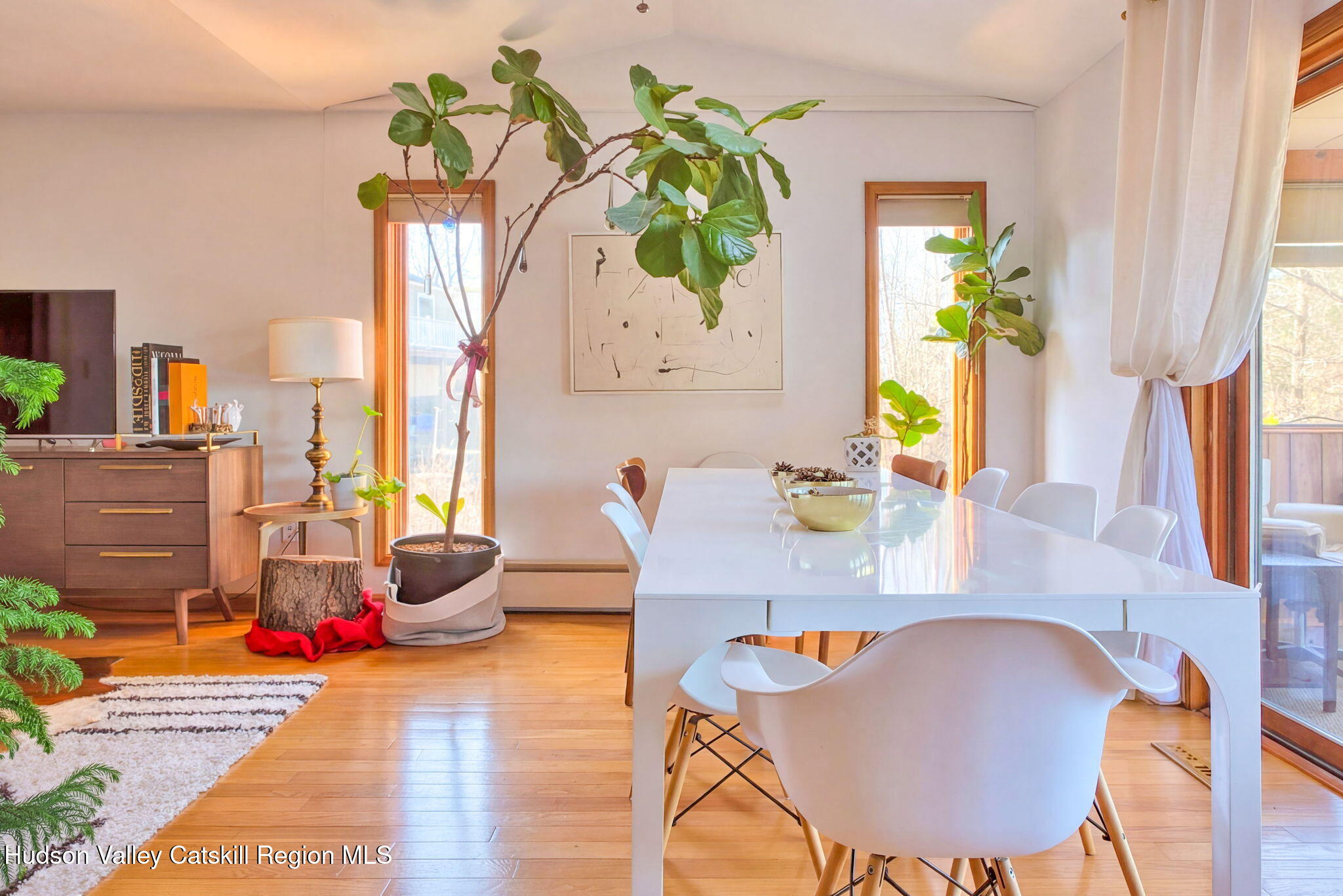 251 Sleepy Hollow Road Athens, NY 12015 - Photo 11 of 60 a dining room with furniture and a wooden floor