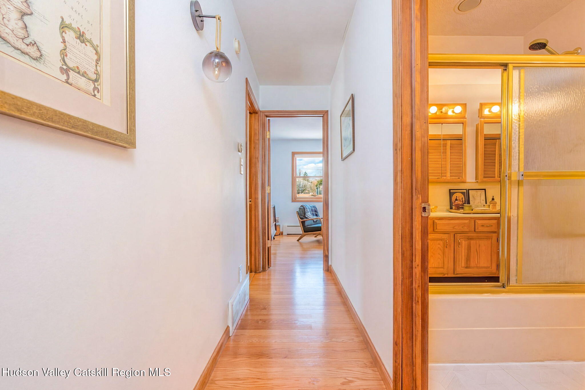 251 Sleepy Hollow Road Athens, NY 12015 - Photo 14 of 60 a view of a hallway with wooden floor and a bathroom