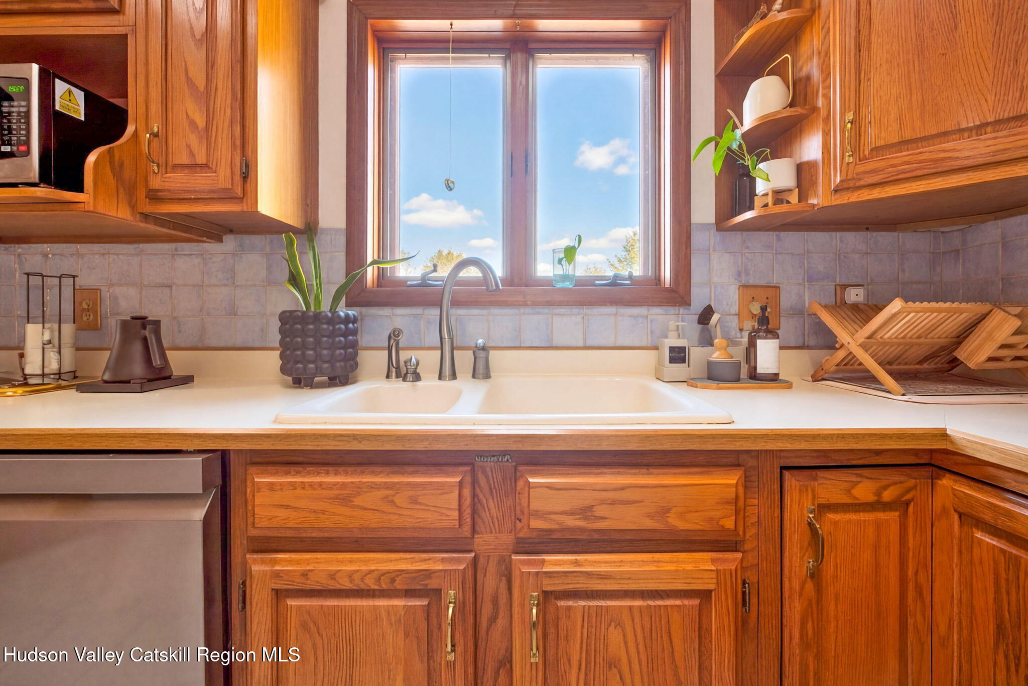 251 Sleepy Hollow Road Athens, NY 12015 - Photo 18 of 60 a kitchen with a sink and cabinets