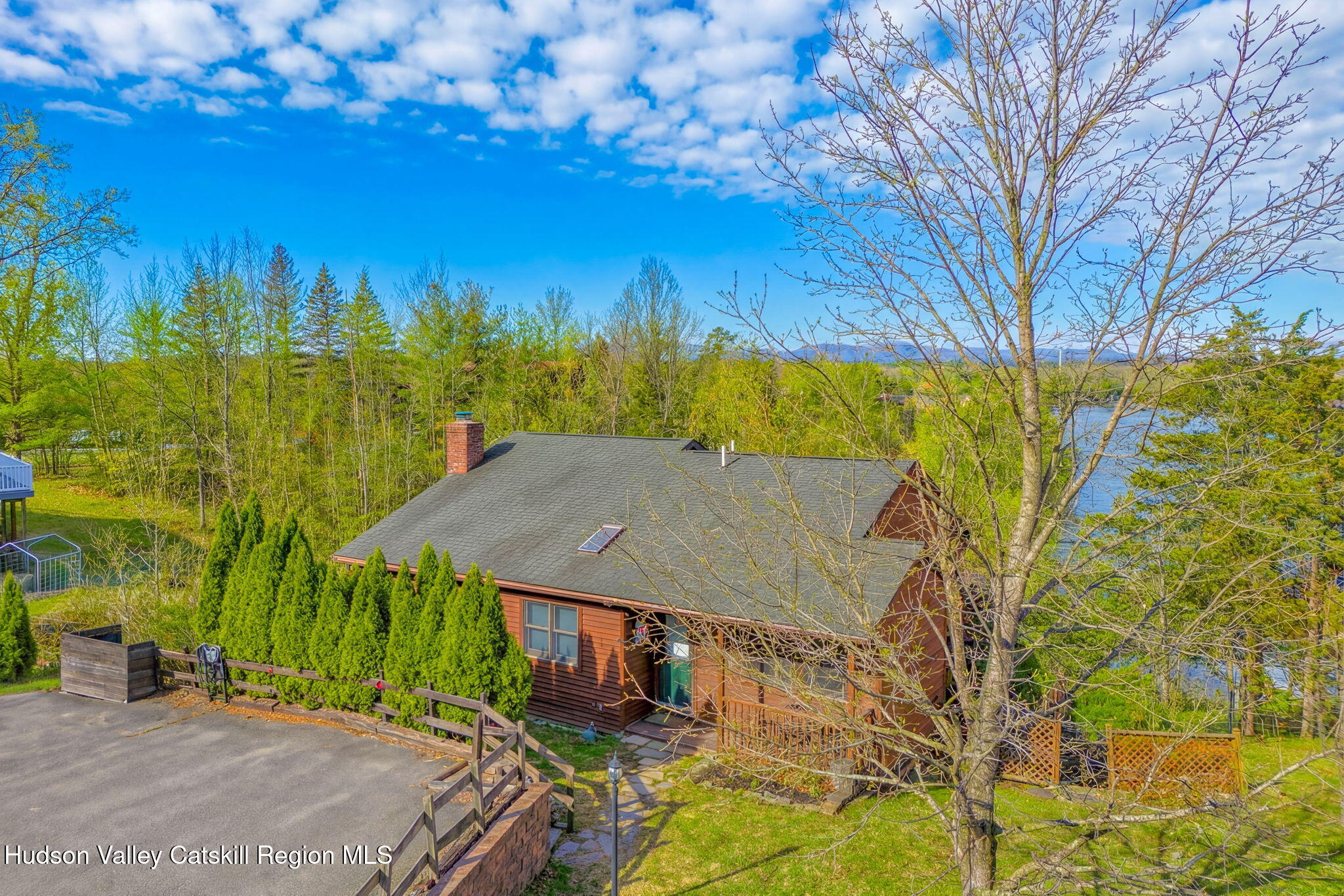 251 Sleepy Hollow Road Athens, NY 12015 - Photo 2 of 60 a roof deck with table and chairs under an umbrella