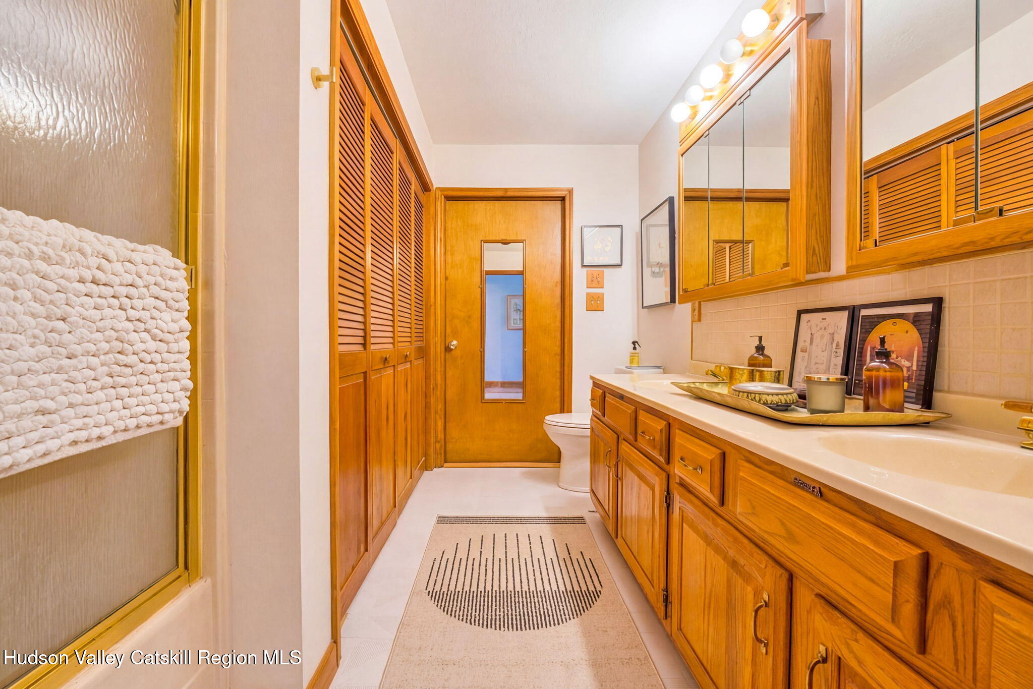251 Sleepy Hollow Road Athens, NY 12015 - Photo 21 of 60 a spacious bathroom with a sink and a window