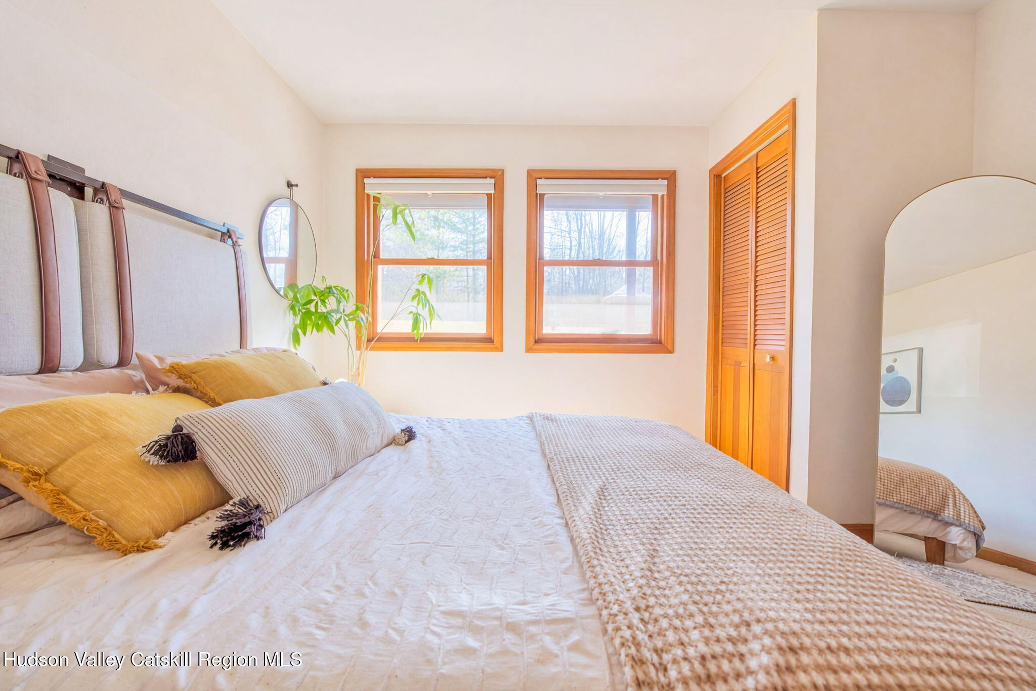 251 Sleepy Hollow Road Athens, NY 12015 - Photo 25 of 60 a bed sitting in a bedroom next to a window