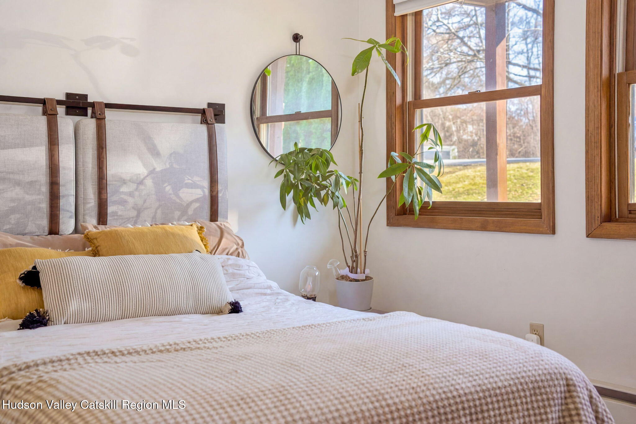 251 Sleepy Hollow Road Athens, NY 12015 - Photo 31 of 60 a large bed sitting in a bedroom next to a window