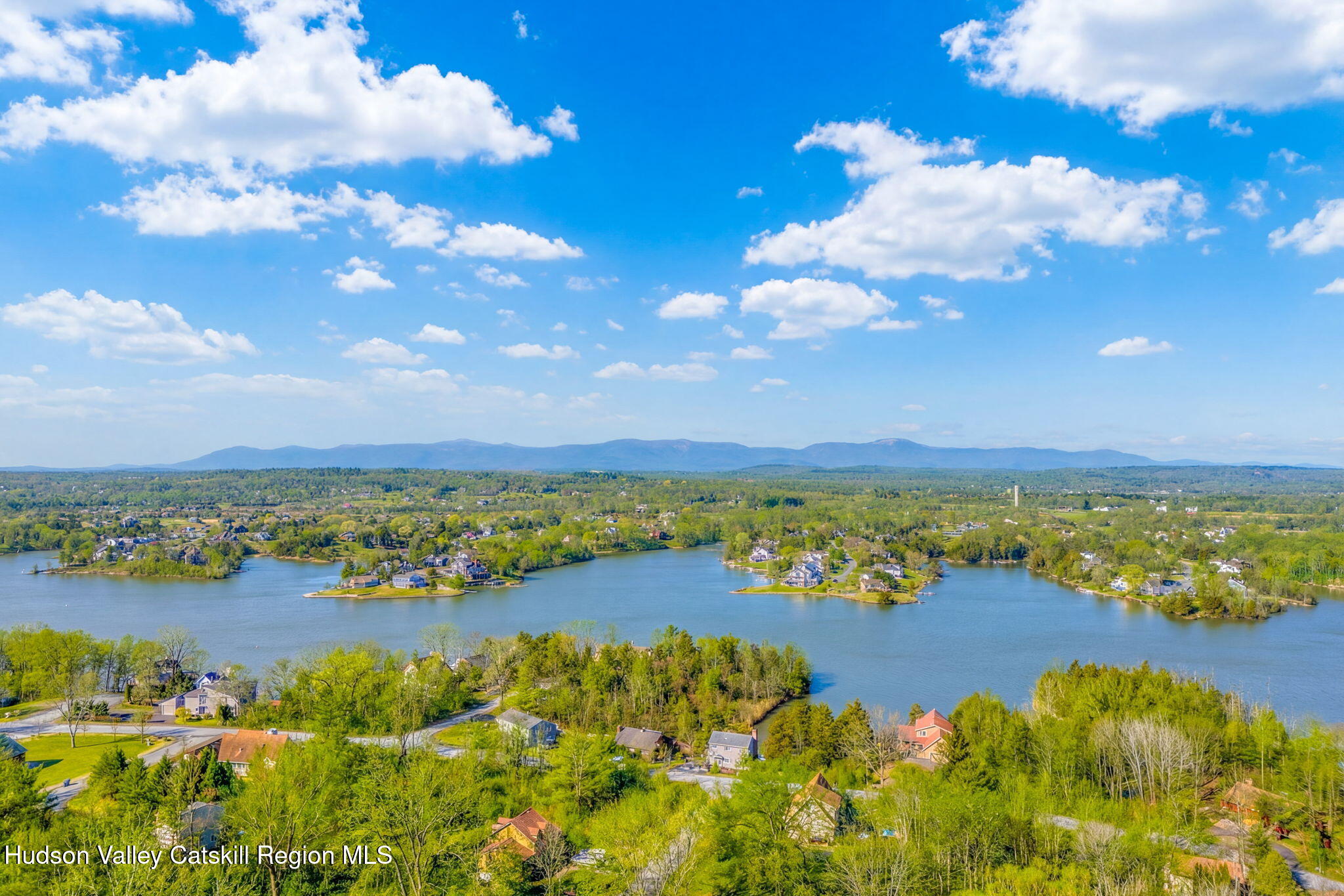 251 Sleepy Hollow Road Athens, NY 12015 - Photo 57 of 60 a view of a city with lots of residential buildings ocean and mountain view in back