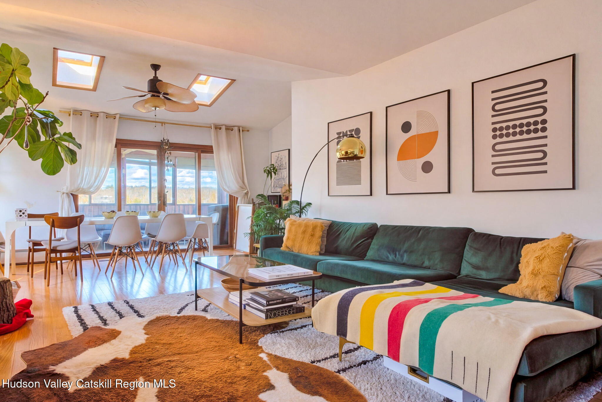 251 Sleepy Hollow Road Athens, NY 12015 - Photo 10 of 60 a living room with furniture and painting on the wall