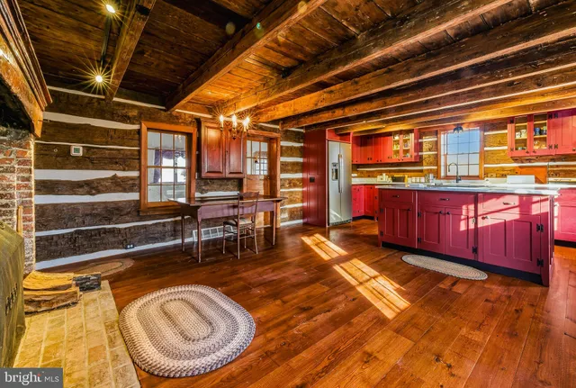 a bedroom with a bed next to a window