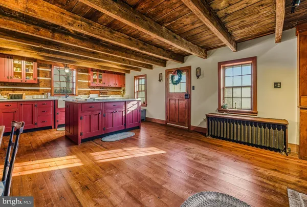 a living room with furniture pool table and a window