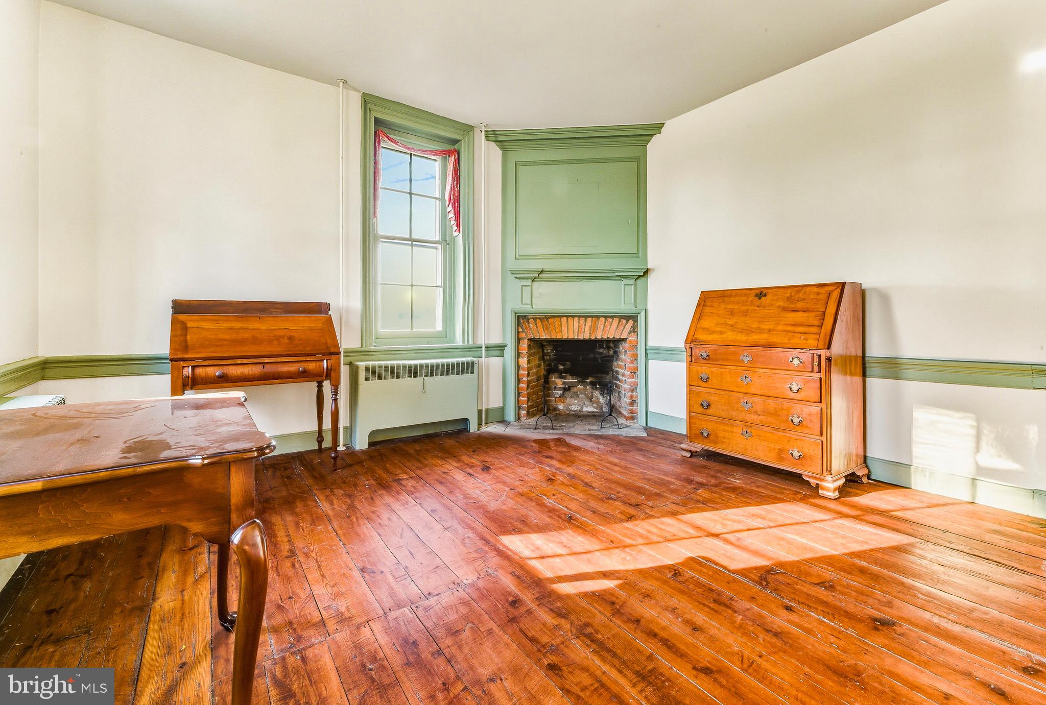 324 Welchville Road Mannington, NJ 08079 - Photo 18 of 50 a living room with a bed and a fireplace