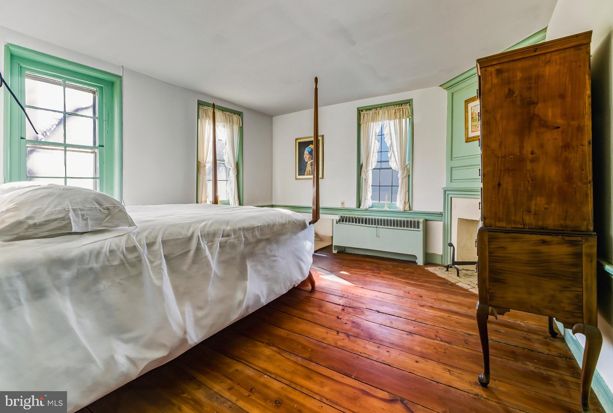 324 Welchville Road Mannington, NJ 08079 - Photo 23 of 50 a bedroom with a bed and wooden floor