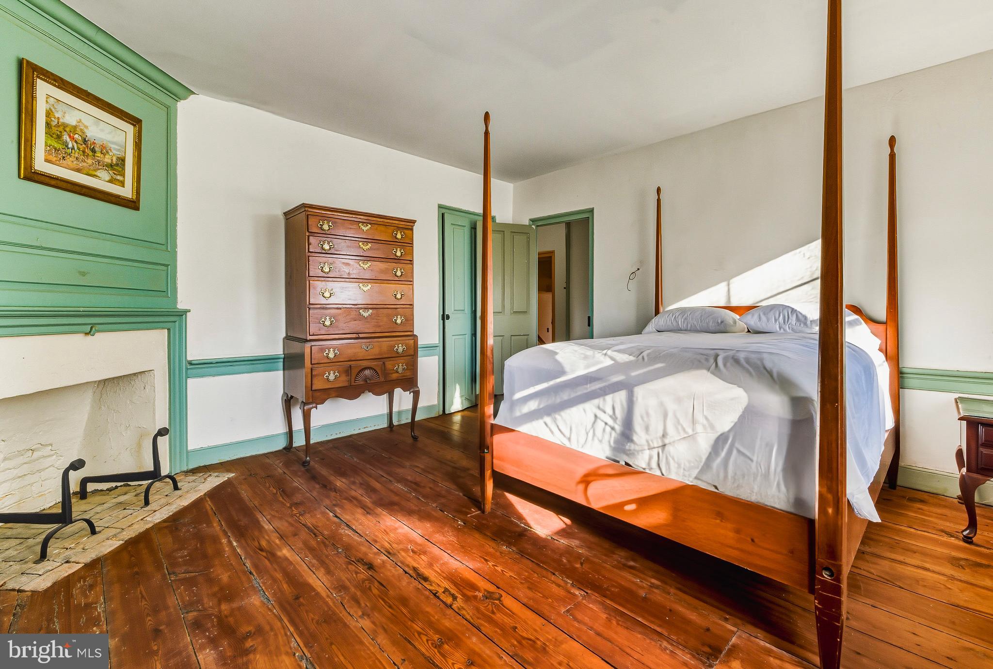 324 Welchville Road Mannington, NJ 08079 - Photo 24 of 50 a bedroom with a bed and wooden floor